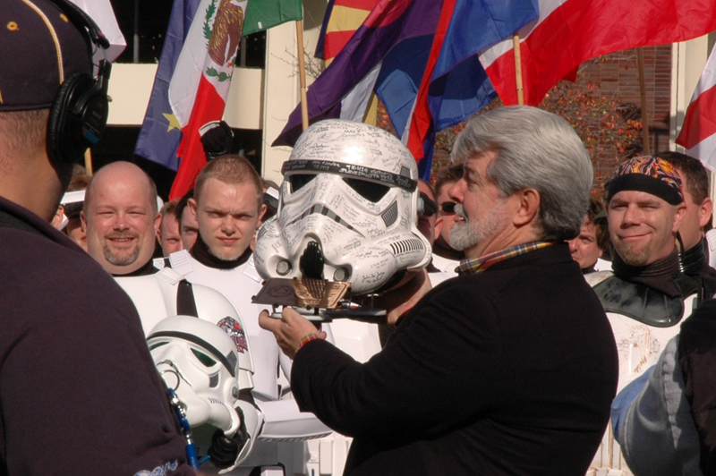 George is presented with a signed Stormtrooper helmet